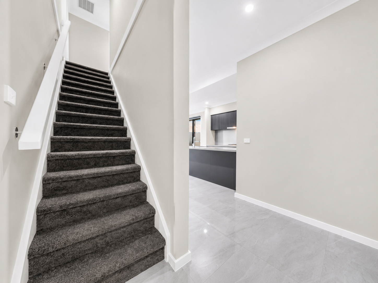 Entry, stairwell and kitchen sightline
