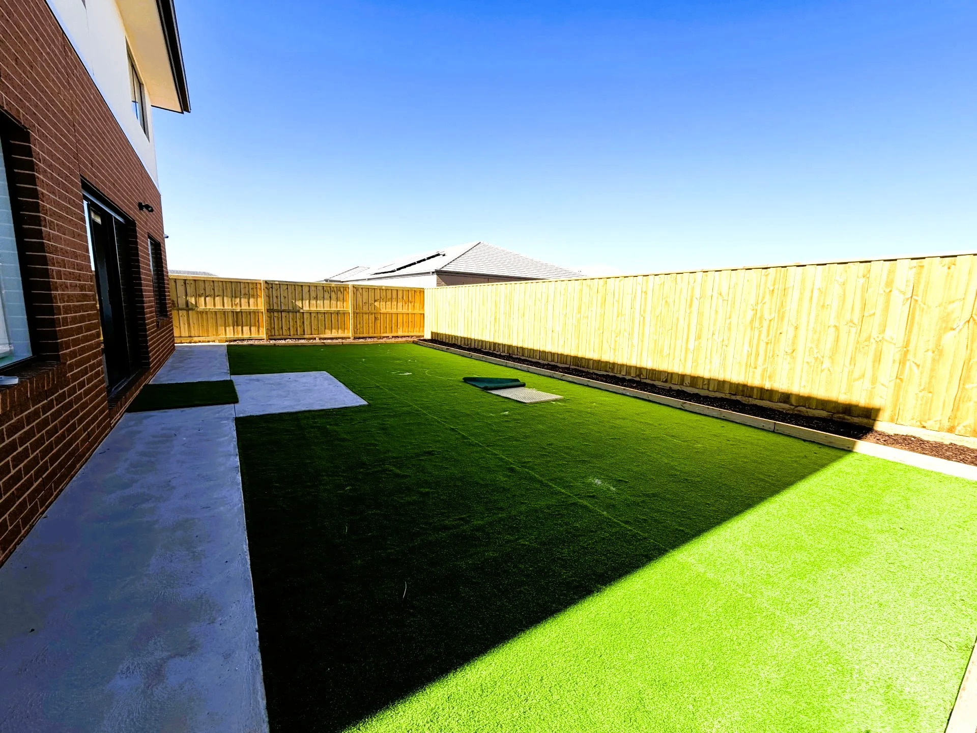 Landscaped rear yard with turf