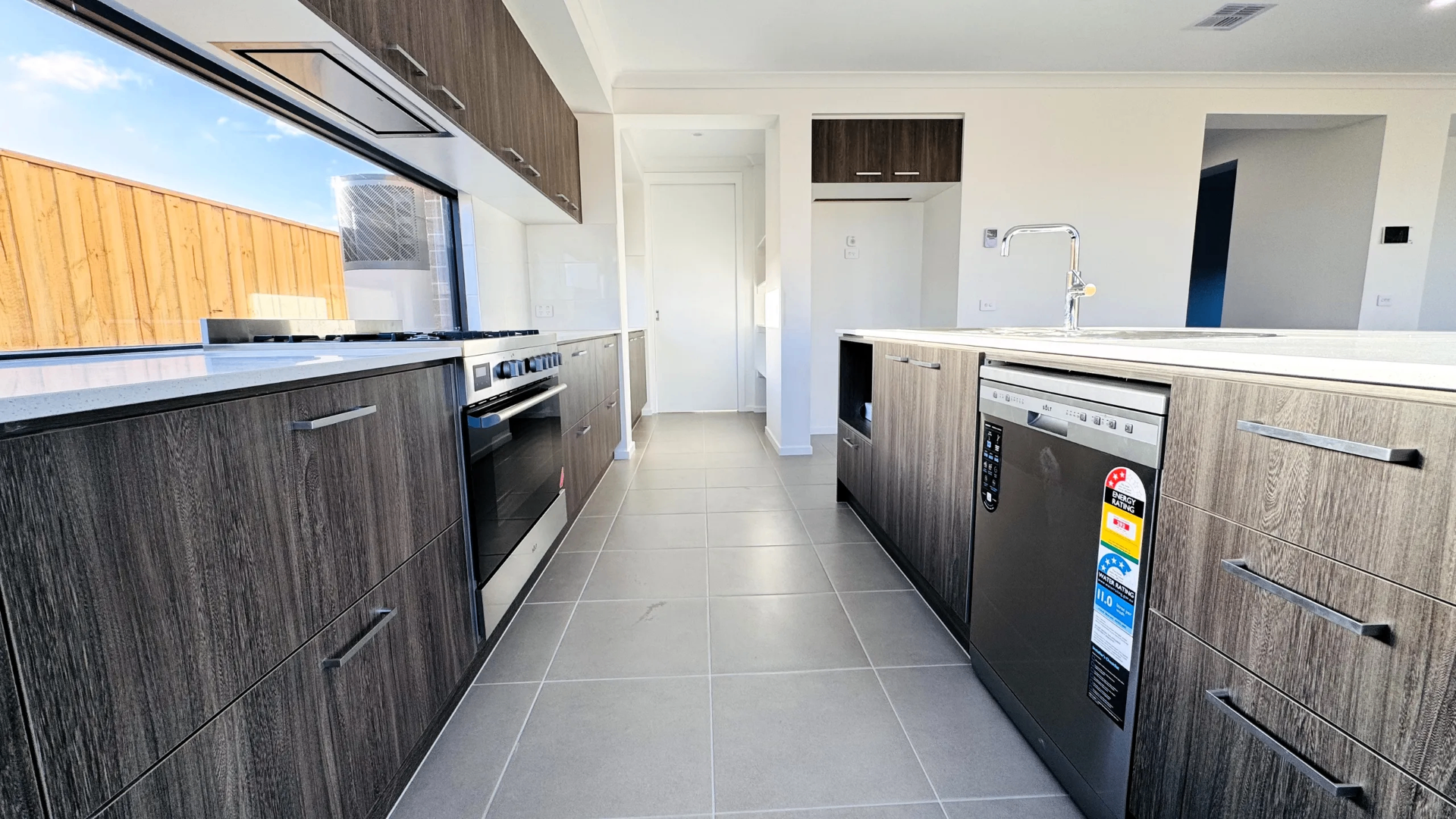 Galley kitchen with integrated appliances